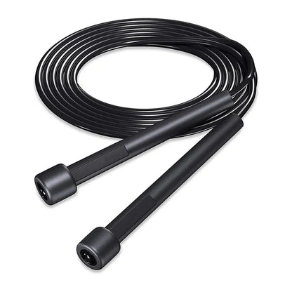 Black jump rope coiled on a white background