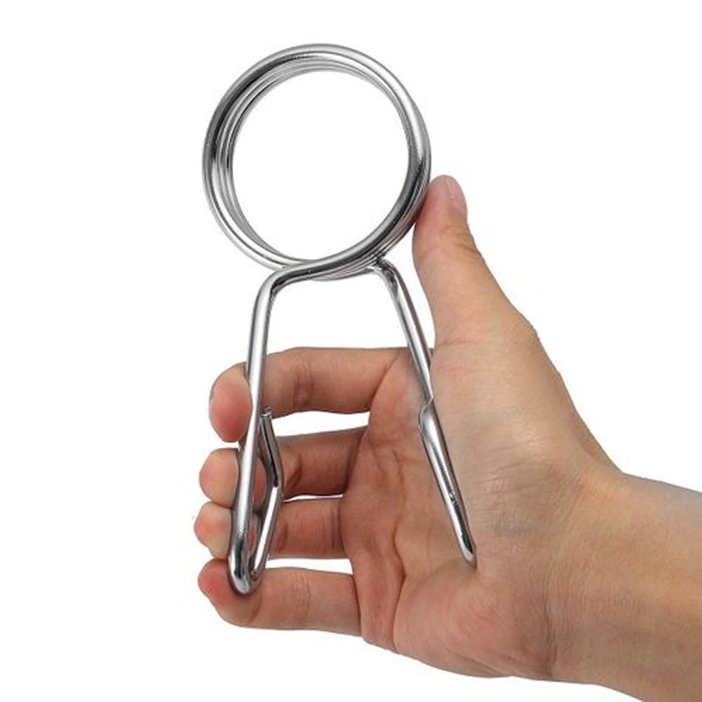 Hand holding a metallic clip against a white background