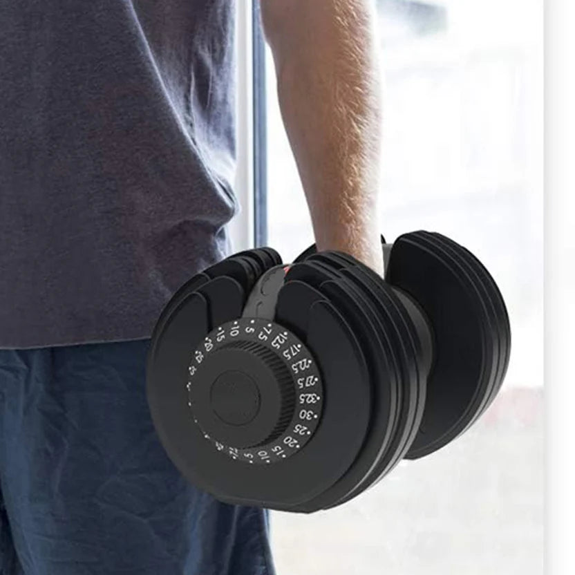 Person holding a pair of adjustable dumbbells with a blurred background
