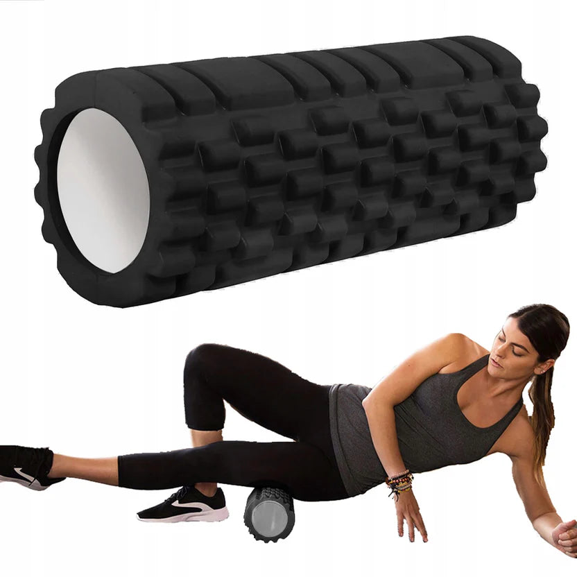 Black foam roller with a woman using it for self-massage on a white background