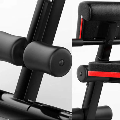Close-up of a black exercise machine with red accents on a white background